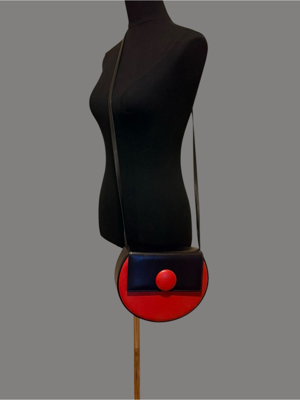 Black and Red Round Crossbody Bag with Button Accent